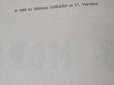a close up of a book with a black and white image on it
