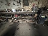 a dirty room with a bunch of tools on the table