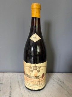 a bottle of wine that is sitting on a table