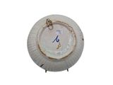 a paper plate with a clock on it on a white background