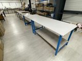 a long table in the middle of a warehouse