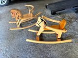 a wooden rocking horse and a wooden rocking horse in a garage