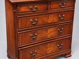an antique mahogany chest of drawers