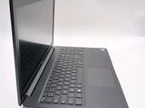 a laptop computer sitting on top of a white table