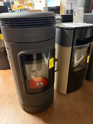 a stove that is sitting next to a trash can