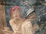 a painting of a woman holding a bird in her hand
