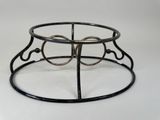 an image of a black metal ring holder on a white surface