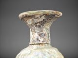 a very old vase that is sitting on a table