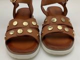 a close up of a pair of sandals on a white surface