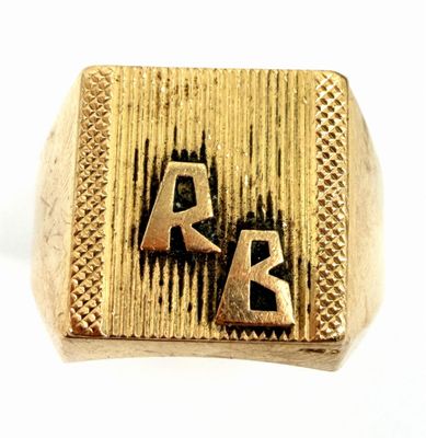 an image of a gold ring with the letters a and k on it