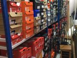boxes are stacked on a shelf in a store with boxes on the shelves