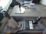 a close up of a car dashboard with a remote control