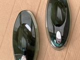 two oval mirrors on a cardboard box on the floor