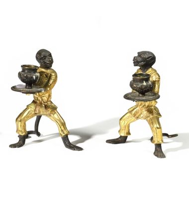 pair of antique brass figurines of two men carrying trays of food