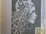 an image of a stamp with a drawing of a woman ' s face