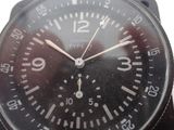 a close up of a black watch with numbers on it