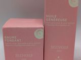 the two boxes are pink and have white labels on them