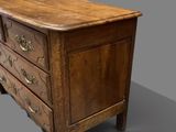 an old wooden chest of drawers on a grey background