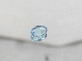 a close up of a blue topaz diamond on a white surface