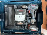 a blue box with tools in it on a table