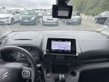 a dashboard view of a car in a parking lot