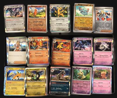 a lot of different pokemon cards on the table