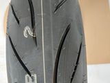 a close up of a motorcycle tire on the ground