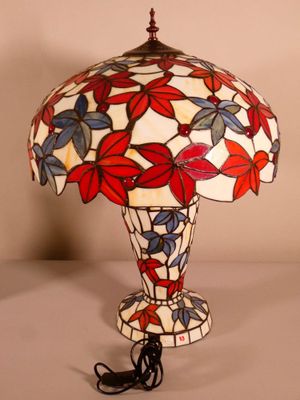 a close up of a lamp on a table with a white background