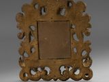 an old wooden picture frame with an ornate design on it