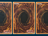 three cards that have a picture of a black hole in them