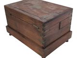 an old wooden box with two drawers on wheels on a white background