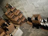 several boxes of wine are stacked on top of each other in a room
