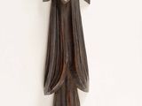 a wooden clock hanging on the wall with a bird on it