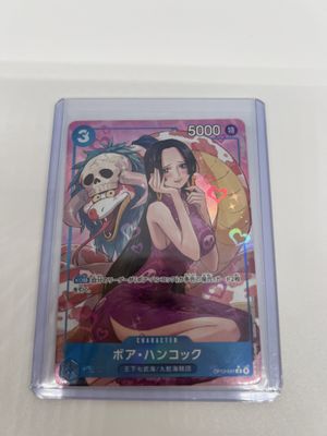 a close up of a card in a plastic case on a table