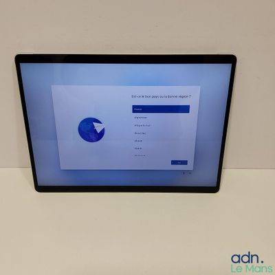 a laptop with a screen showing a pie chart on the screen