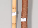 a wooden stick and a wooden stick with a tag on it
