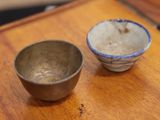 a small bowl and a smaller bowl sitting on a table