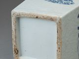 a blue and white box with a picture of a bird on it
