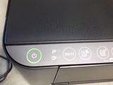 a printer that is sitting on a table next to a mouse