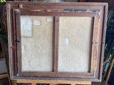 a picture of an old wooden cabinet with a glass door