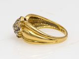 a close up of a gold ring with diamonds on it