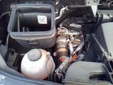 a picture of a car engine with its hood open