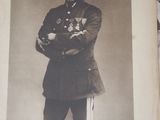 an old photo of a man in a military uniform posing for a picture