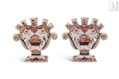 pair of antique vases with floral designs on them on a white background
