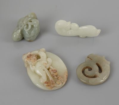 three jade figurines of animals and a bird