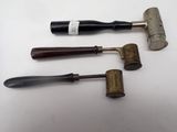 three different types of tools are sitting on a white surface