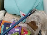 a box full of toys and books and a blue umbrella