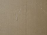 a picture of a piece of cardboard that has been torn off