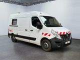 a white van with red stripes parked in a room