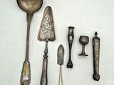 a lot of silver spoons and spoon spoons on a white surface